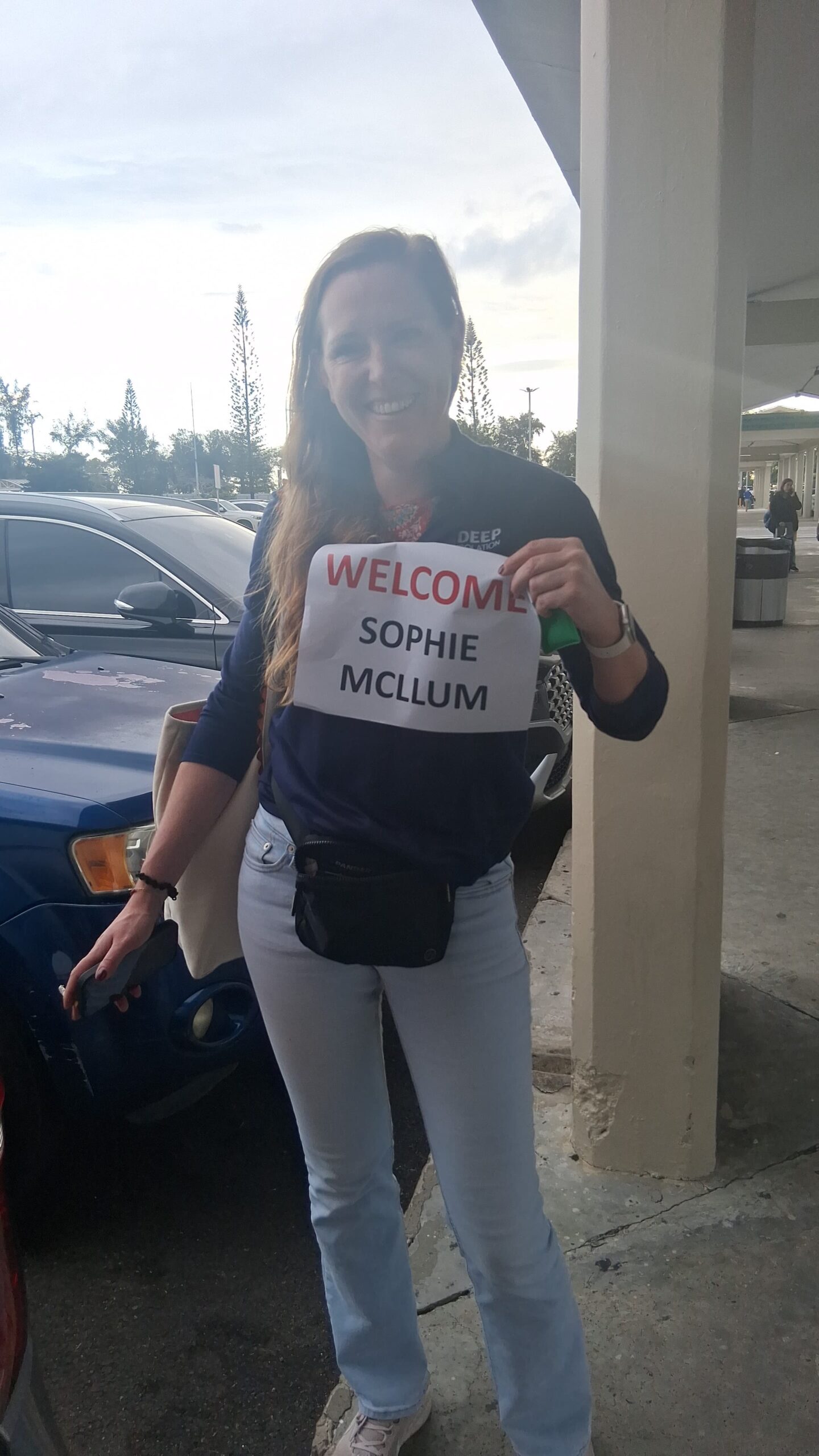 Best Price Private Punta Cana Airport to Hotel Transfer-customer with her sign